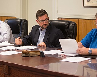 From left, Michael Dockry, Jason Loree and Keith Rogers of the ABC Water and Storm Water District review business during the board's meeting Wednesday at Canfield Township hall. People primarily from Boardman expressed frustration during the meeting over flooding from a May 28 storm.