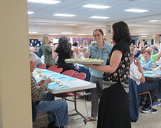 Neighbors | Jessica Harker.Students and staff members served dinner to senior citizens April 24 at Austintown Fitch High School.