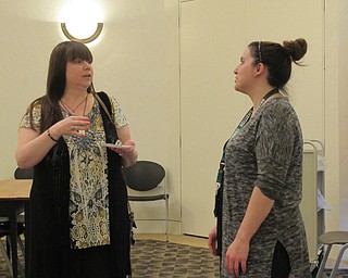 Neighbors | Jessica Harker.Librarian Renee Beverly assisted community members in creating their own Game of Thrones necklace at the Austintown library April 23.