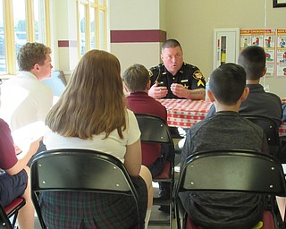 Neighbors | Jessica Harker.A variety of careers, including police officer, were represented at St. Charles' Alumni Career Day on May 6.