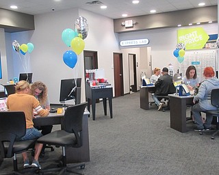 Neighbors | Jessica Harker . Eyemart Express employees met with customers May 4 during the store's grand opening event.