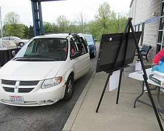 Neighbors | Jessica Harker.Cars lined up around the parking lot at Angels for Animals May 3 to buy a Lasagna Dinner for the organizations funraider.