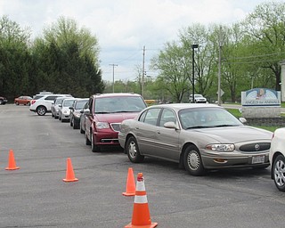 Neighbors | Jessica Harker.A constant stream of more than 20 cars were lined up around the parking lot at Angels for Animals on May 3 for the organization's Lasagna Dinner fundraising event.
