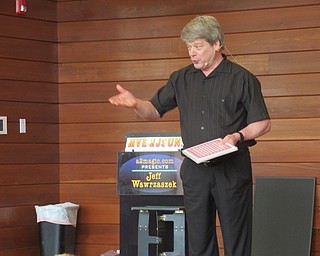 Neighbors | Jessica Harker .Magician Jeff Wawrzaszek hosted the Supernatural Intergalatical Summer Reading Spectacular magic show at the Michael Kusalaba library June 7. .