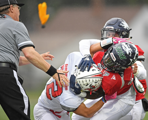 NILES, OHIO - JUNE 13, 2019: Mahoning County's Ralph Fitzgerald, red, and Trumbull County's Benton Tennant fight in the first half of their game, Thursday night at Niles McKinley High School. Trumbull County won 10-6. DAVID DERMER | THE VINDICATOR