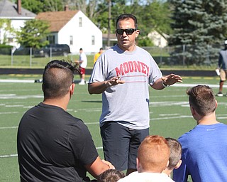  ROBERT K.YOSAY  | THE VINDICATOR..Cardinal Mooney annual Football Camp of Champions for kids 3-8 - about 125 football players attended the two day camp ..PJ  Fecko.. Mooneys head coach - gives some pointers to the  campers