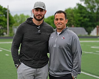 YOUNGSTOWN, OHIO - JUNE 13, 2019: Mooney Head coach PJ Fecko poses for a picture with New England Patriots linebacker John Simon, Thursday morning during the Cardinal Mooney Champ of Champions at Cardinal Mooney High School. DAVID DERMER | THE VINDICATOR