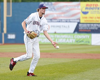 The Scrappers' Matt Turner tosses the ball to first during their game against the Muckdogs at Eastwood Field on Sunday evening. EMILY MATTHEWS | THE VINDICATOR