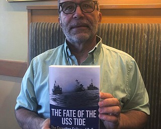 Mark Zangara, author of The Fate of the USS Tide poses with his book. Zangara is also the founder of the WW2 History Archive.
