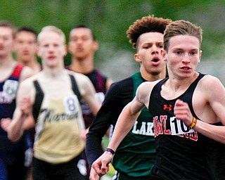 Vincent Mauri of Howland High School leads the pack during the boys 800-meter run at the All-American Conference Red Tier High School Track Championships at Austintown Fitch Greenwood Chevrolet Falcon Stadium on Tuesday.