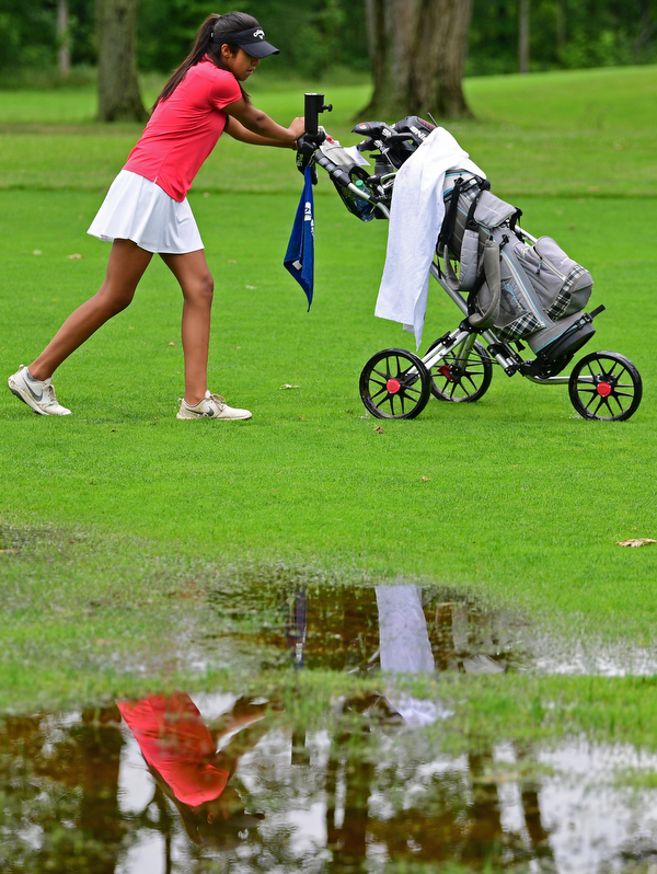 BOARDMAN, OHIO - JUNE 18, 2019: Avi Gill, of Northville, Michigan, walks her cart to the green on the tenth hole, Tuesday afternoon at Mill Creek Golf Course during he first round of the American Junior Golf Association Tournament. DAVID DERMER | THE VINDICATOR