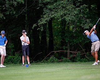 Jiakai Chen, right, of Guangzhou, China, drives the ball while Patrick O'Leary, left, of Beverly Hills, Michigan, and Logan McCarrell, center, of Dublin, Ohio, watch during the second round of the Mahoning Valley Hospital Foundation Junior All-Star AJGA tournament at Mill Creek Golf Course on Wednesday. EMILY MATTHEWS | THE VINDICATOR