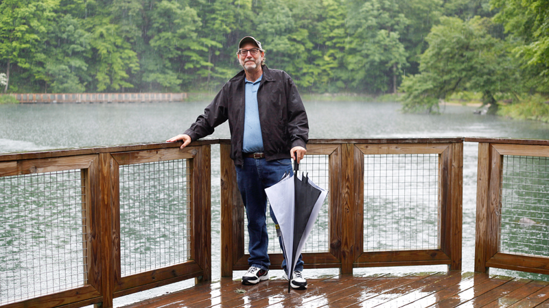 Murray Davis, former chairman of Mill Creek MetroParks’ development committee, stands by the Lily Pond in Mill Creek Park. Davis advocated for the installation of an aeration system at the pond to prevent fish kills.