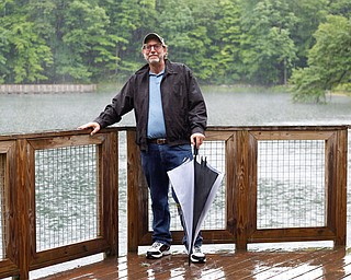 Murray Davis, former chairman of Mill Creek MetroParks’ development committee, stands by the Lily Pond in Mill Creek Park. Davis advocated for the installation of an aeration system at the pond to prevent fish kills.