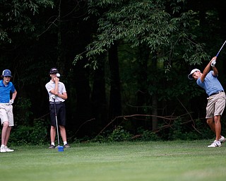 Jiakai Chen, right, of Guangzhou, China, drives the ball while Patrick O'Leary, left, of Beverly Hills, Michigan, and Logan McCarrell, center, of Dublin, Ohio, watch during the second round of the Mahoning Valley Hospital Foundation Junior All-Star AJGA tournament at Mill Creek Golf Course on Wednesday. EMILY MATTHEWS | THE VINDICATOR
