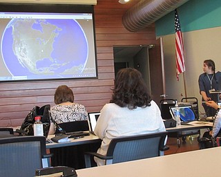 Neighbors | Jessica Harker.Librarian Hannah Matulek taught community members how to use the Google Earth program April 23 for Earth Day.