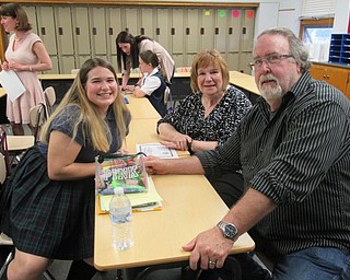 Neighbors | Jessica Harker.St. Christine's student Arrianna Wendt sat in her class with her grandparents on May 2 during the school's annual Grandparents Day.