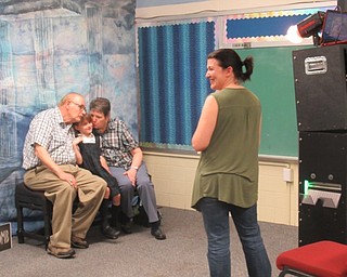 Neighbors | Jessica Harker.St. Christine's set up two photobooths in the school for students to use with their grandparent's May 3 at the schools annual Grandparents Day.