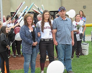 Neighbors | Jessica Harker.Senior member of the Boardman softball team Brooke Hoffman walked onto the field escorted by her parents for the team's annual senior night.