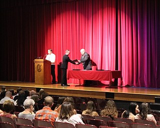 Neighbors | Abby Slanker.Canfield High School junior Jacob Fay accepted his certificate from principal Mike Moldovan during the Parent Teacher Association Academic Awards Program on May 2.