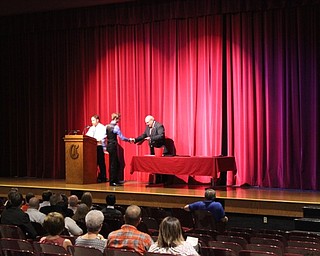 Neighbors | Abby Slanker.Canfield High School senior Gregory Halley shook hands with principal Mike Moldovan as he  accepted his certificate during the Parent Teacher Association Academic Awards Program on May 2.