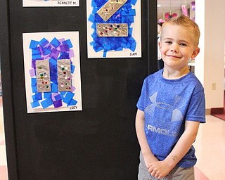 Neighbors | Abby Slanker.Canfield United Methodist Preschool four-year-old class member Liam Masello proudly displayed his Sparkly Art project at the school’s annual art show on May 9.