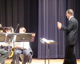 Neighbors | Jessica Harker.Poland band director Jeff Hvizdos directed students during the school's annual spring band concert.