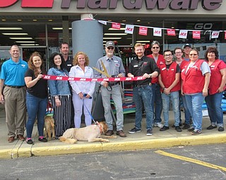 Neighbors | Jessica Harker.Ace Hardware owners and employees prepared to cut the ribbon, officially opening the new store located at 451 Boardman Canfield Road.