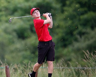 Tyler Andersen, 16, of Columbiana, watches after he hits the ball during the Greatest Golfer junior qualifiers at Reserve Run Golf Course on Thursday. EMILY MATTHEWS | THE VINDICATOR
