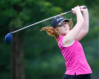 Elizabeth Keller, 14, of Canfield, watches the ball after driving it during the Greatest Golfer junior qualifiers at Reserve Run Golf Course on Thursday. EMILY MATTHEWS | THE VINDICATOR