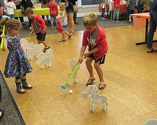 Neighbors | Jessica Harker .Children played safari themed mini golf at the Safari Party hosted by the Canfield library on June 13.