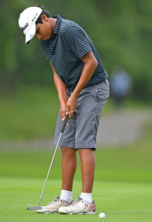 BOARDMAN, OHIO - JUNE 20, 2019: Asher Joseph. of Melbourne, Florida, watches his putt on the 18th hole during the final round of the American Junior Golf Association Tournament. DAVID DERMER | THE VINDICATOR