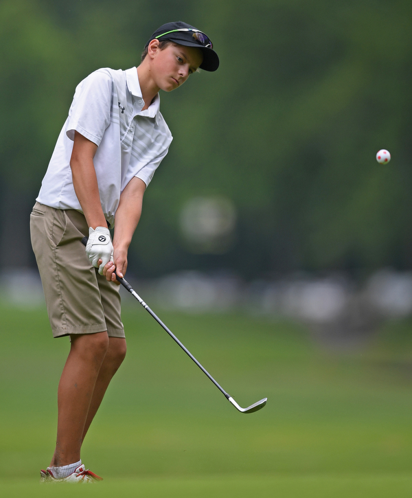 BOARDMAN, OHIO - JUNE 20, 2019: Alex Long. of Toronto, Ontario, watches his chip shot on the 17th hole during the final round of the American Junior Golf Association Tournament. DAVID DERMER | THE VINDICATOR