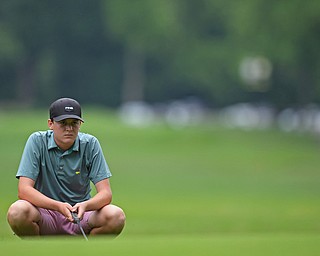 BOARDMAN, OHIO - JUNE 20, 2019: Jackson Finney, of Louisville, Kentucky, reads the green on the 17th hole during the final round of the American Junior Golf Association Tournament. DAVID DERMER | THE VINDICATOR