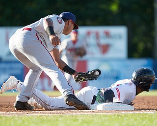 Scrappers' Korey Holland gets back to first before Doubledays' Albert Carrillo could tag him during their game at Eastwood Field on Friday night. EMILY MATTHEWS | THE VINDICATOR