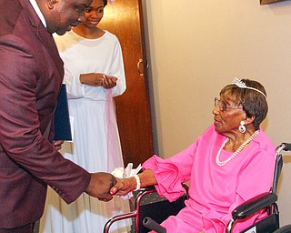 William D. Lewis The Vindicator Rev. Flonerra Henry-Harris shares a moment with Youngstown Mayor tito Brown. A 100th birthday party for Rev. Henry -Harris was held at Mahoning Country Club in Girard 6-21-19.