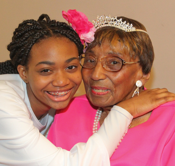 William D. Lewis The Vindicator Rev. Flonerra Henry-Harris shares a moment  her great grandaughter,Trinity Spencer, 15, of Youngstown. A 100th birthday party for Rev. Henry -Harris was held at Mahoning Country Club in Girard 6-21-19.