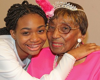 William D. Lewis The Vindicator Rev. Flonerra Henry-Harris shares a moment  her great grandaughter,Trinity Spencer, 15, of Youngstown. A 100th birthday party for Rev. Henry -Harris was held at Mahoning Country Club in Girard 6-21-19.