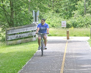 Dave Roberts of Austintown heads back to the Kirk Road trail head after hitting the end of the Great Ohio Lake to River Greenway in Mill Creek MetroParks. The 100-mile Greenway, about 80 percent of which has been built, would connect Lake Erie to the Ohio River through four counties, beginning at the lake in Ashtabula County, spanning Trumbull and Mahoning counties, and ending at the river in East Liverpool in Columbiana County. 