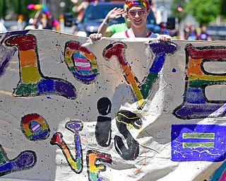 Cole White of Girard marches during the Pride parade around Courthouse Square in downtown Warren. The city hosted its first Pride parade and festival Saturday.
