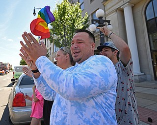 WARREN, OHIO - JUNE 22, 2019: Joseph Jackson, of Niles, waves a Pride flag during the start of the Pride parade around Courthouse square, Saturday afternoon during the Pride Festival. DAVID DERMER | THE VINDICATOR