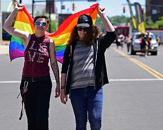 WARREN, OHIO - JUNE 22, 2019: Huckleberry Mines, of Warren, left, and Jennifer Parker, of Warren, walk around courthouse square, Saturday afternoon during the Pride Festival. DAVID DERMER | THE VINDICATOR