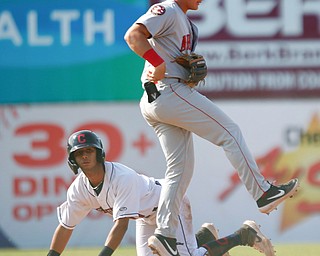 Scrappers' Brayan Rocchio slides into second as Doubledays' J.T. Arruda tries to get to the bag during their game at Eastwood Field on Sunday. EMILY MATTHEWS | THE VINDICATOR