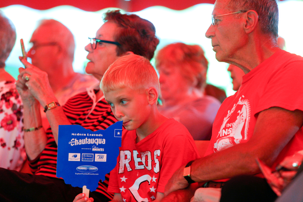 Charlie Litman, 8, of Cincinnati, listens to music with his grandparents Jean and Chuck Potashnik, of Warren, at Warren Chautauqua on Tuesday evening. EMILY MATTHEWS | THE VINDICATOR