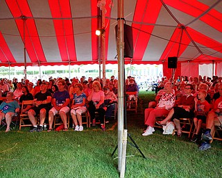 People watch and listen to Susan Marie Frontczak give a presentation as Erma Bombeck at Warren Chautauqua on Tuesday evening. EMILY MATTHEWS | THE VINDICATOR