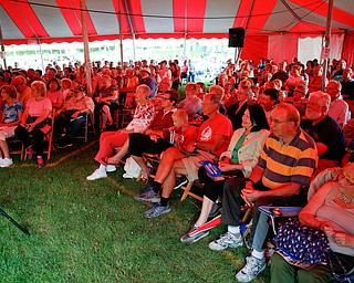 People watch and listen to Susan Marie Frontczak give a presentation as Erma Bombeck at Warren Chautauqua on Tuesday evening. EMILY MATTHEWS | THE VINDICATOR