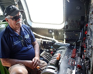 Scott Gupton, with the Commemorative Air Force, sits in front of the flight engineers panel of a B-29 at the Warren Regional Airport on Wednesday. The B-29 and an AT6 were at the airport for people to look at and learn about. EMILY MATTHEWS | THE VINDICATOR