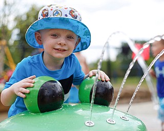 Silas Turner, 2, of Warren, plays with water at the water park in the James L. Wick, Jr. Recreation Area in Mill Creek Park on Thursday. EMILY MATTHEWS | THE VINDICATOR
