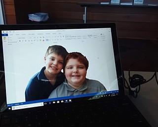 Neighbors | Submitted.Community member Ginger Zink designed a puzzle with her grandsons on it for Mother's Day May 11 at the Michael Kusalaba library.