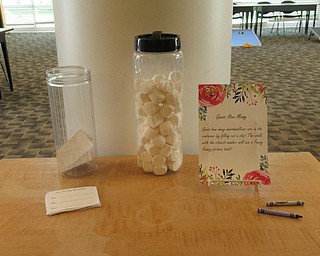 Neighbors | Jessica Harker.Children had the opportunity to guess how many marshmellows were in the jar May 11 at the Austintown library's Mommy and Me for Tea event.